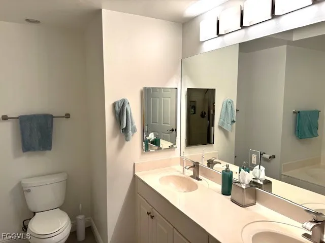 a bathroom with a sink and mirror