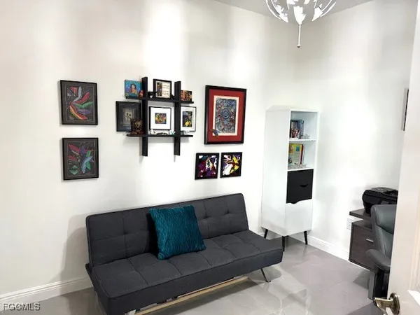 a view of a workspace with furniture