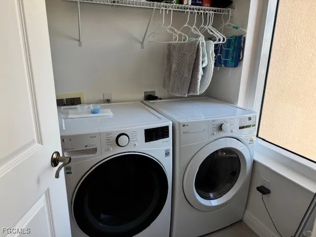 a room with pool table and windows