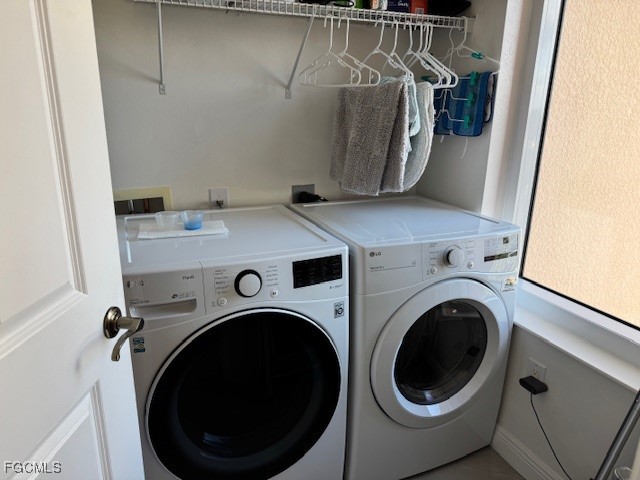 2745 First Street, Unit 1305 Fort Myers, FL 33916 - Photo 30 of 36 a utility room with dryer and washer