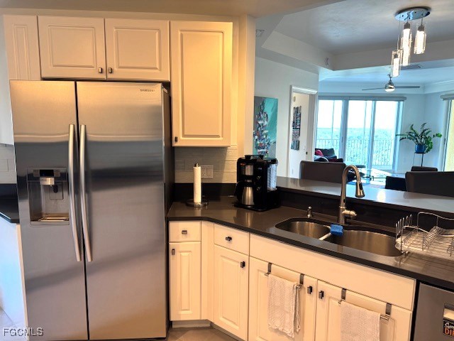 2745 First Street, Unit 1305 Fort Myers, FL 33916 - Photo 8 of 36 a kitchen with granite countertop a refrigerator and a sink