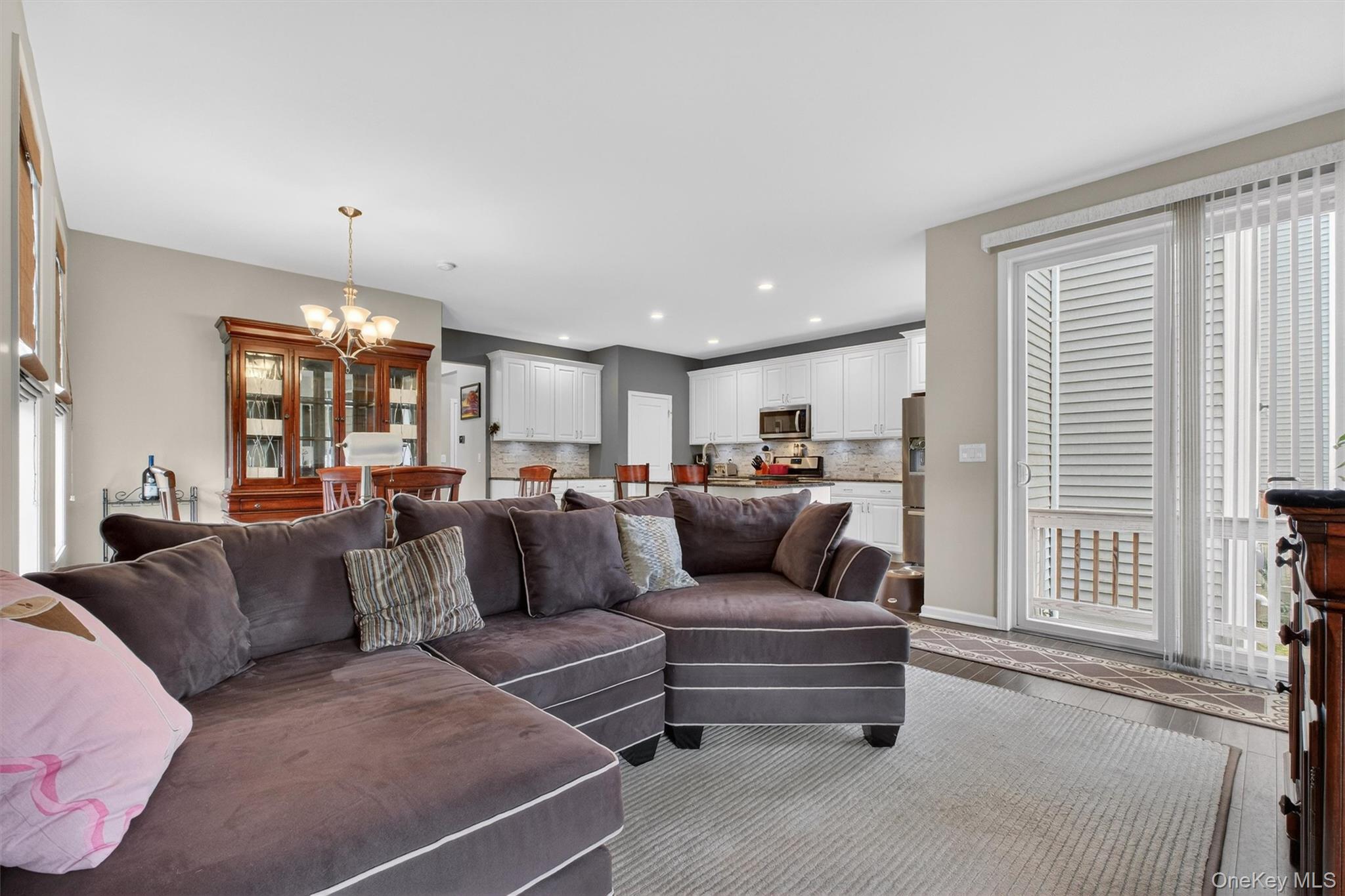 25 Hoffman Road Hopewell Junction, NY 12533 - Photo 14 of 35 a living room with furniture and a chandelier