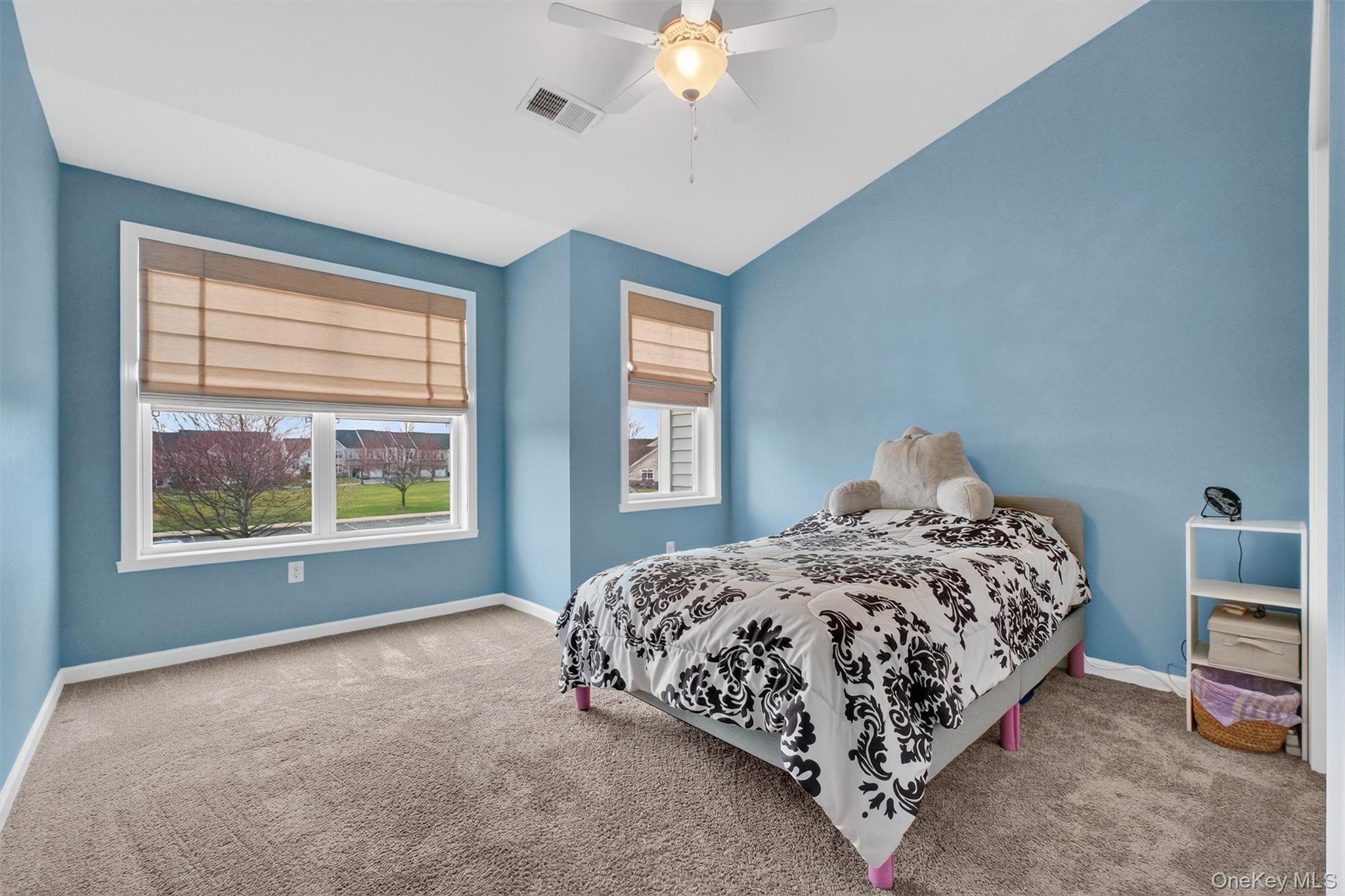 25 Hoffman Road Hopewell Junction, NY 12533 - Photo 24 of 35 a bedroom with a bed and a chandelier