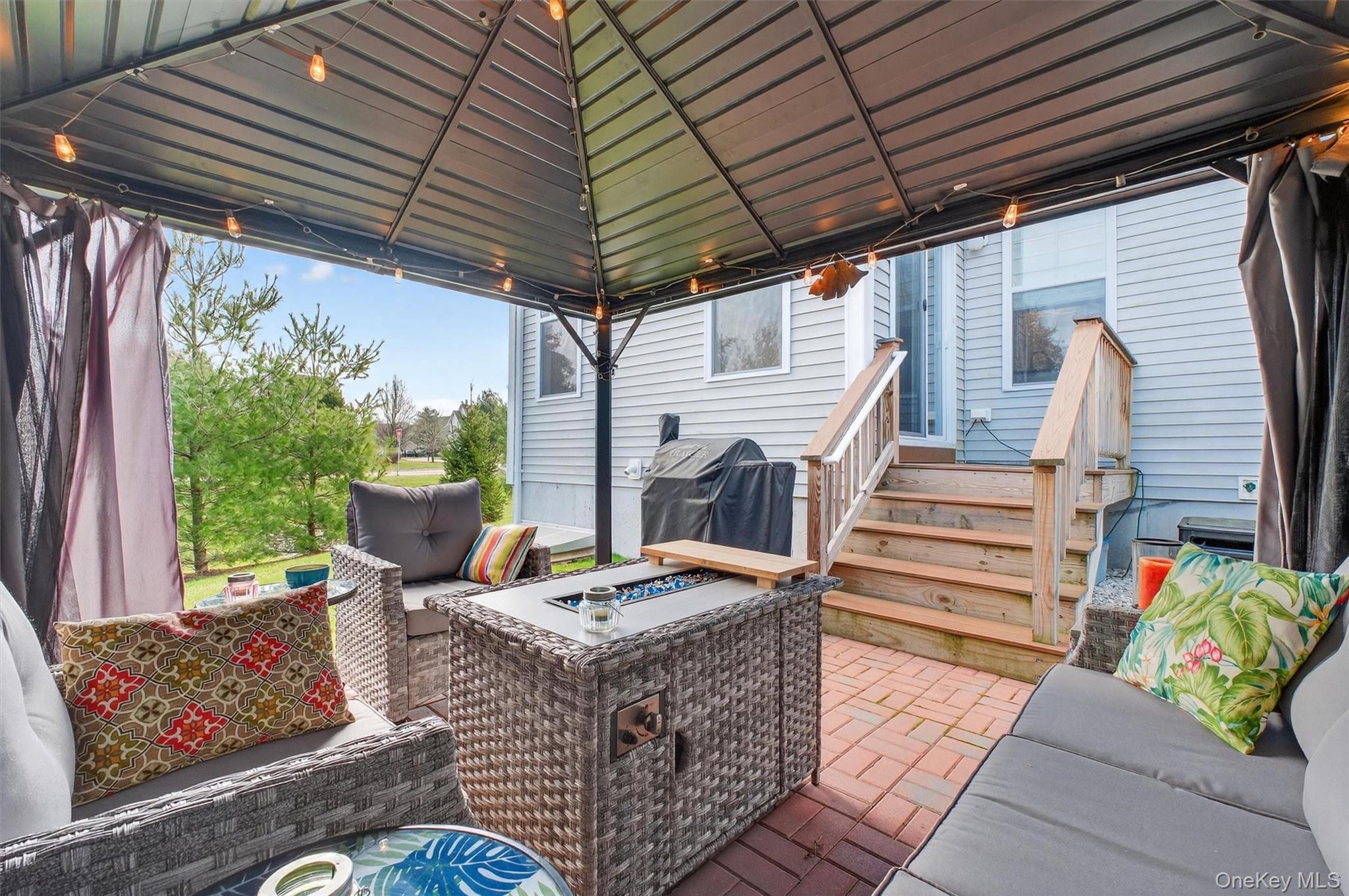 25 Hoffman Road Hopewell Junction, NY 12533 - Photo 31 of 35 a outdoor living space with patio furniture and a fireplace
