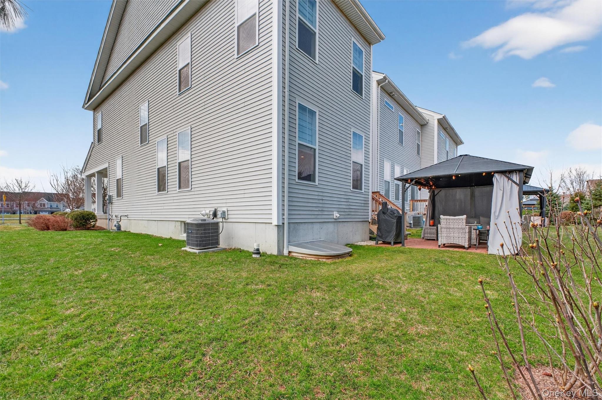 25 Hoffman Road Hopewell Junction, NY 12533 - Photo 33 of 35 a view of a house with a backyard and sitting area