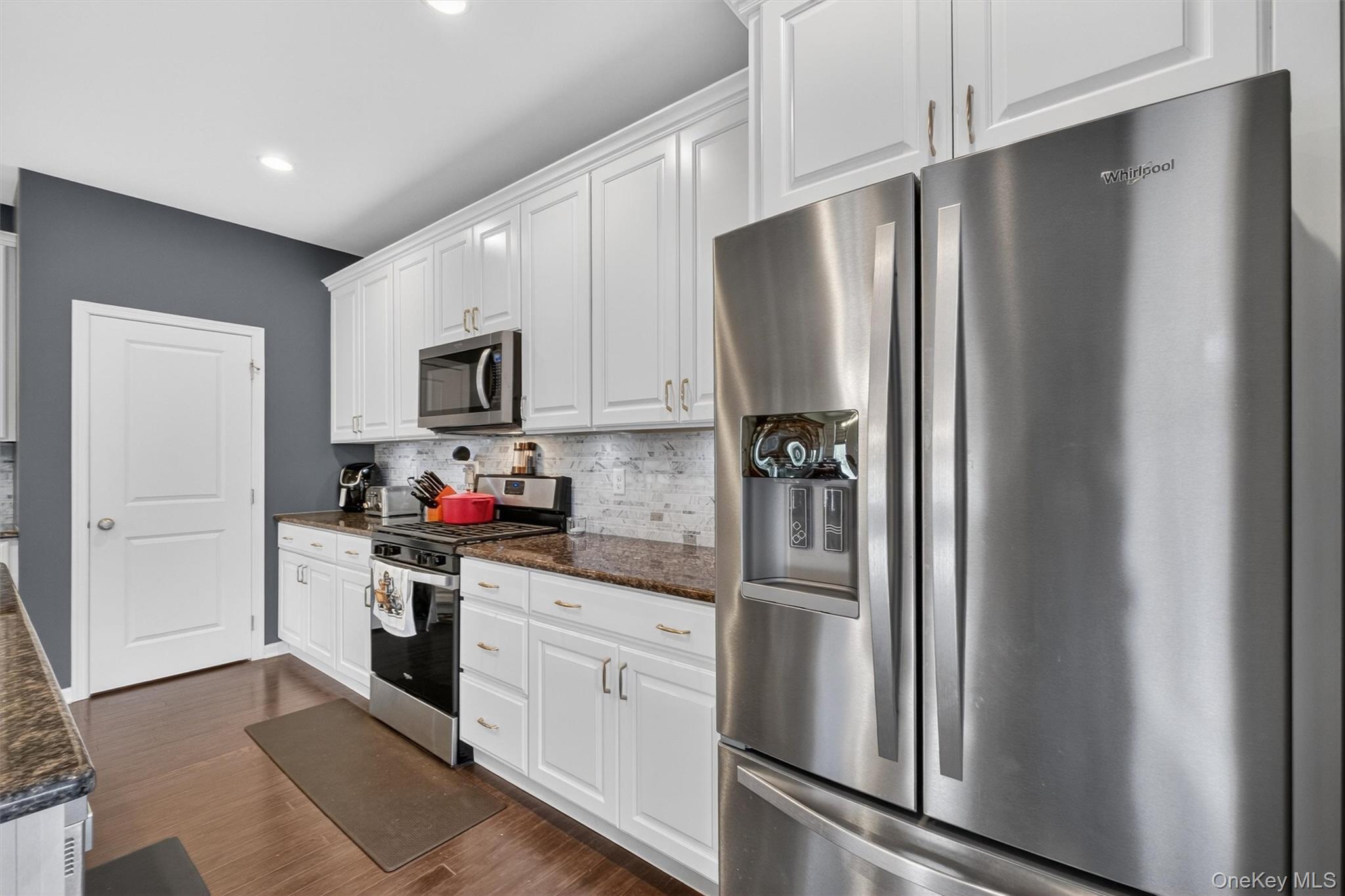 25 Hoffman Road Hopewell Junction, NY 12533 - Photo 7 of 35 a kitchen with stainless steel appliances a refrigerator sink and microwave