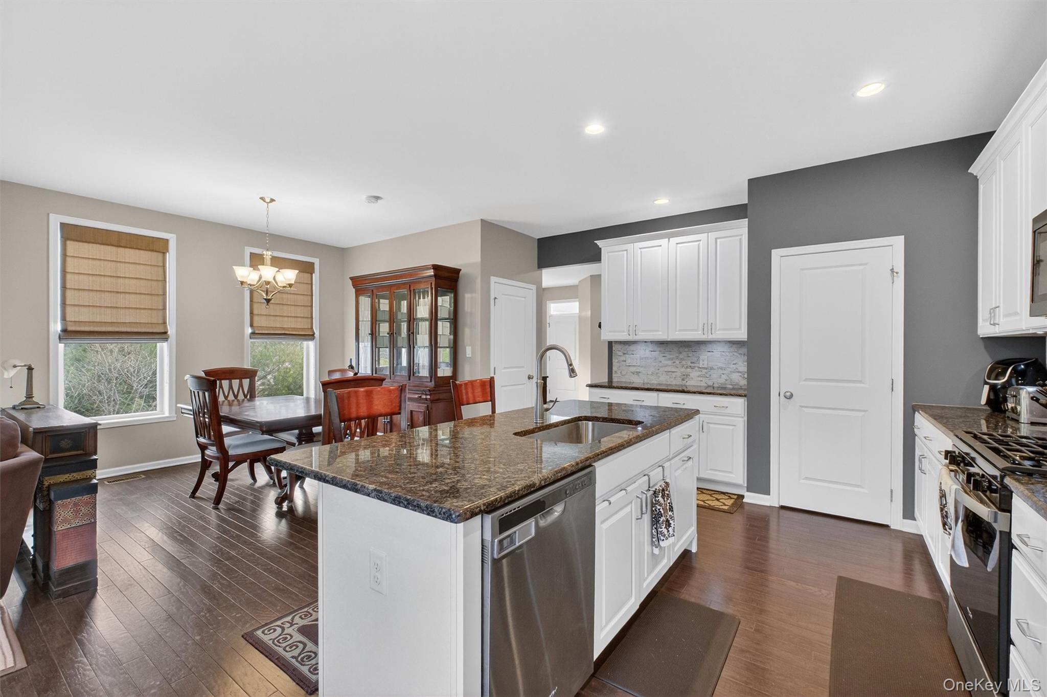 25 Hoffman Road Hopewell Junction, NY 12533 - Photo 8 of 35 a kitchen with stainless steel appliances granite countertop a stove and chairs