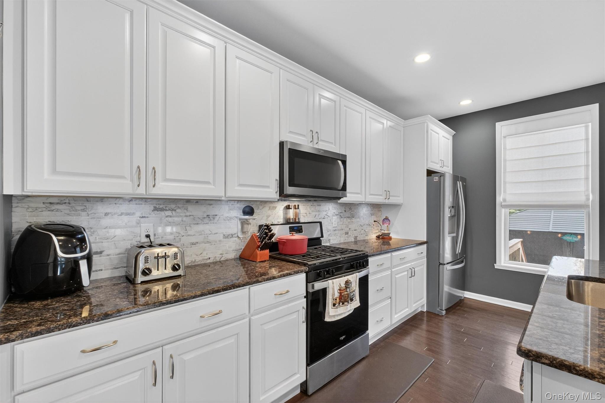 25 Hoffman Road Hopewell Junction, NY 12533 - Photo 10 of 35 a kitchen with stainless steel appliances granite countertop a sink stove and refrigerator