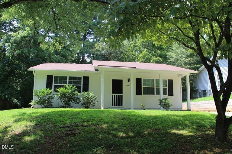 a view of a house with garden and garden