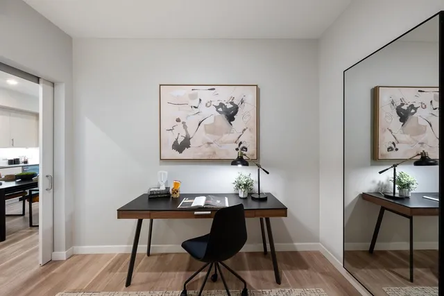 a view of a workspace with furniture