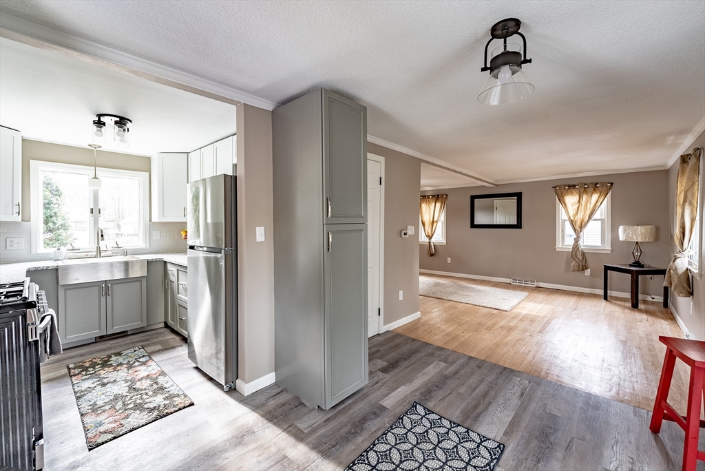 54 Kittrell Street Springfield, MA 01119 - Photo 7 of 33 a kitchen with a refrigerator and windows