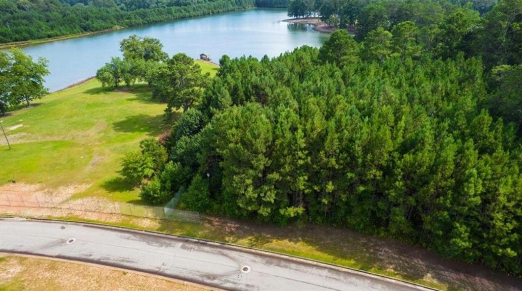 722 Giverny Boulevard Fairburn, GA 30213 - Photo 4 of 8 a view of a lake from a yard
