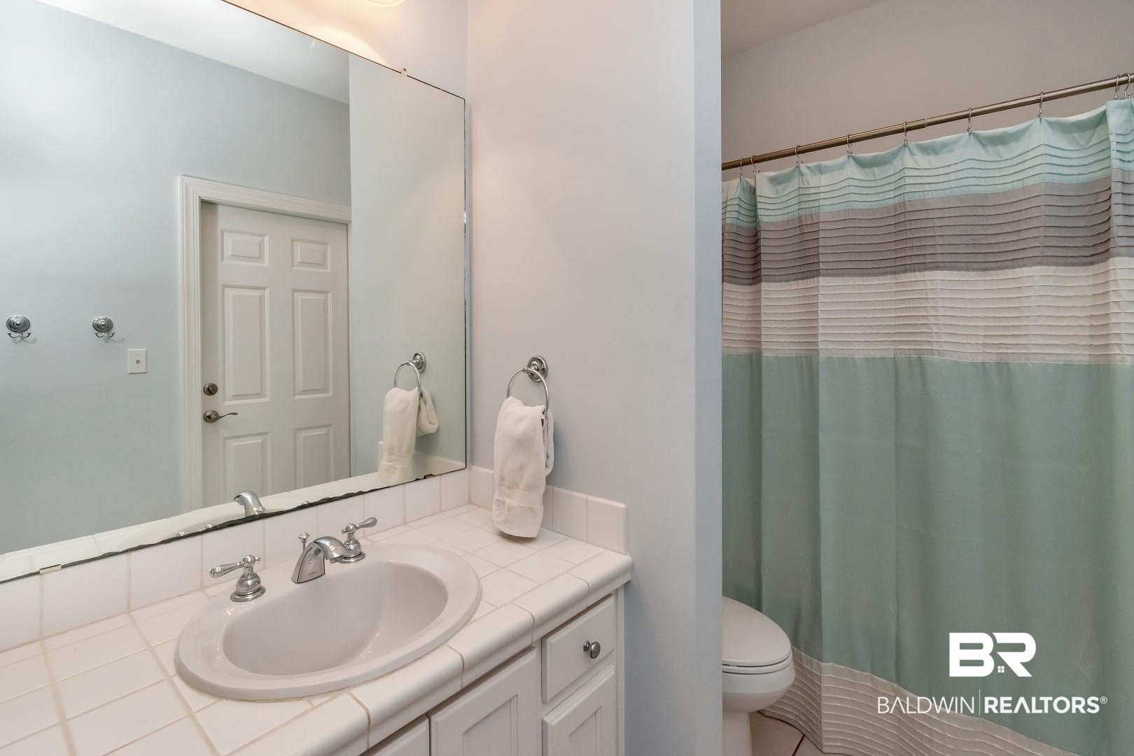 3500 North Riviere Du Chien Loop Mobile, AL 36693 - Photo 27 of 74 Bathroom with a shower with curtain, vanity, and toilet