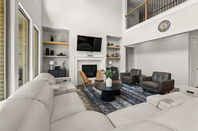 a living room with furniture fireplace and a flat screen tv