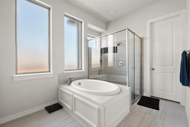 a bathroom with a bathtub and a sink