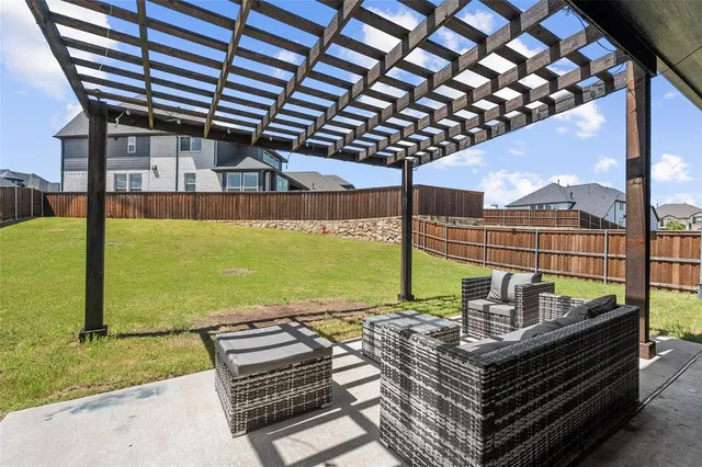 a view of a chairs and table in the patio
