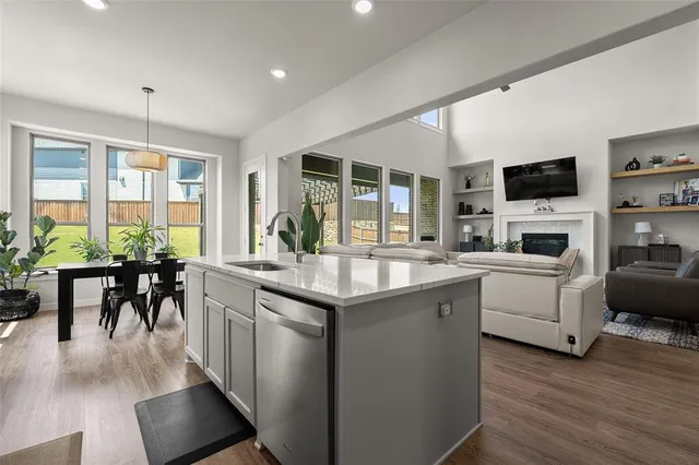 a kitchen with a sink and stove