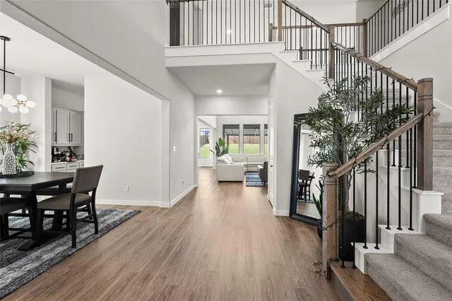 a view of a livingroom with furniture and hardwood floor
