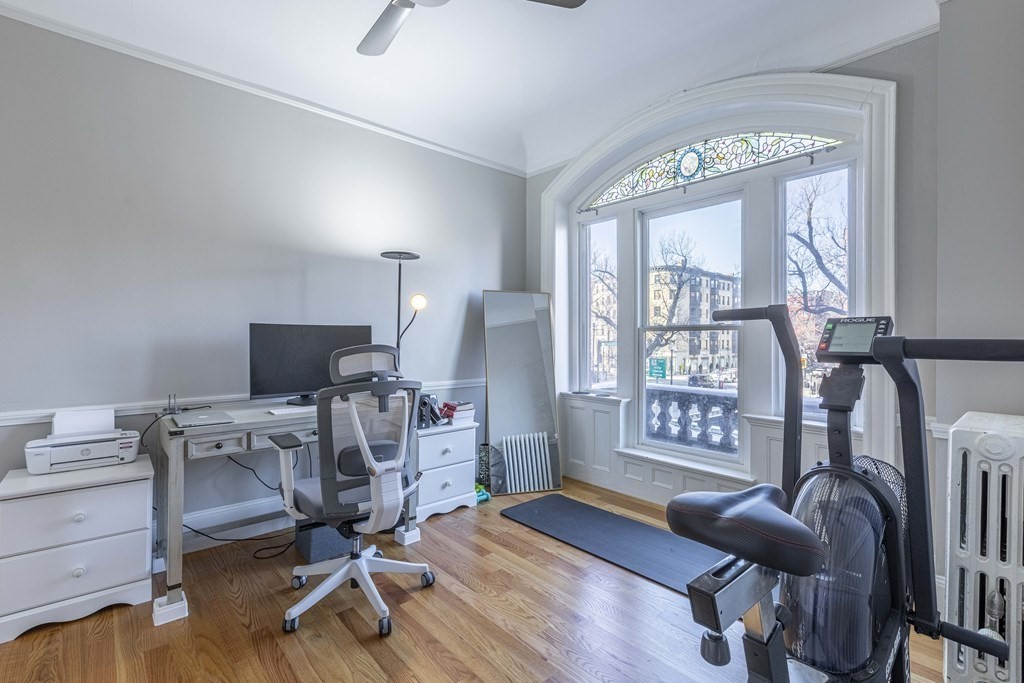 362 Commonwealth Avenue, Unit 2A Boston, MA 02115 - Photo 20 of 38 a view of a livingroom with workspace and a window