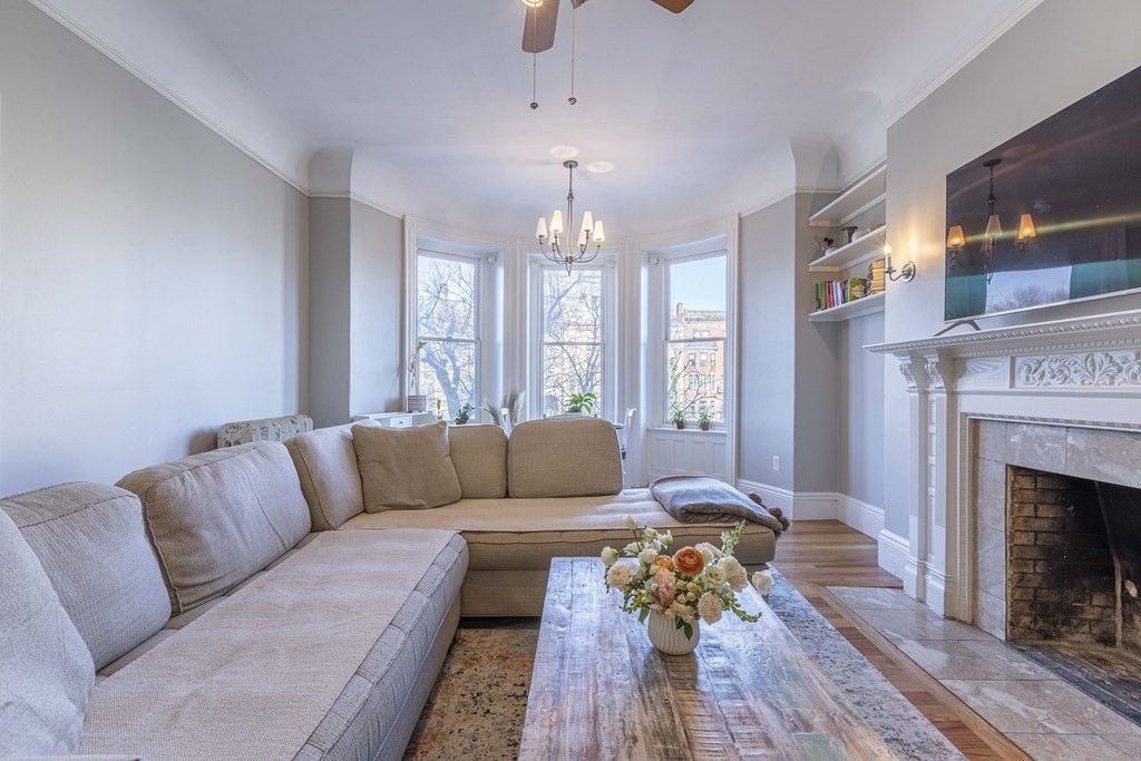 362 Commonwealth Avenue, Unit 2A Boston, MA 02115 - Photo 2 of 38 a living room with furniture fireplace and window