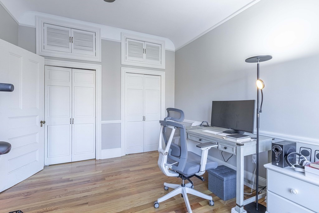 362 Commonwealth Avenue, Unit 2A Boston, MA 02115 - Photo 23 of 38 a view of a workspace with furniture and wooden floor
