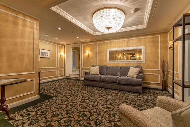 a living room with furniture and a table