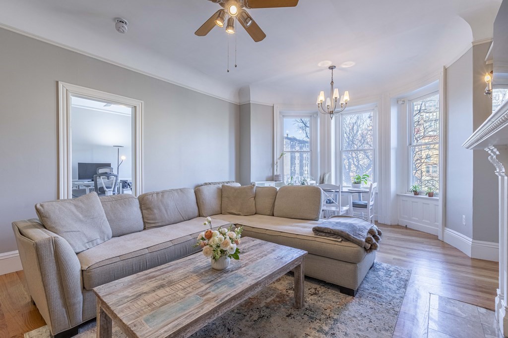 362 Commonwealth Avenue, Unit 2A Boston, MA 02115 - Photo 3 of 38 a living room with furniture and a chandelier