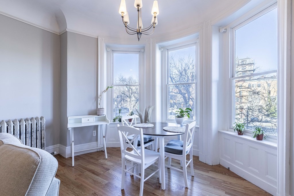 362 Commonwealth Avenue, Unit 2A Boston, MA 02115 - Photo 7 of 38 a view of a dining room with furniture window and wooden floor