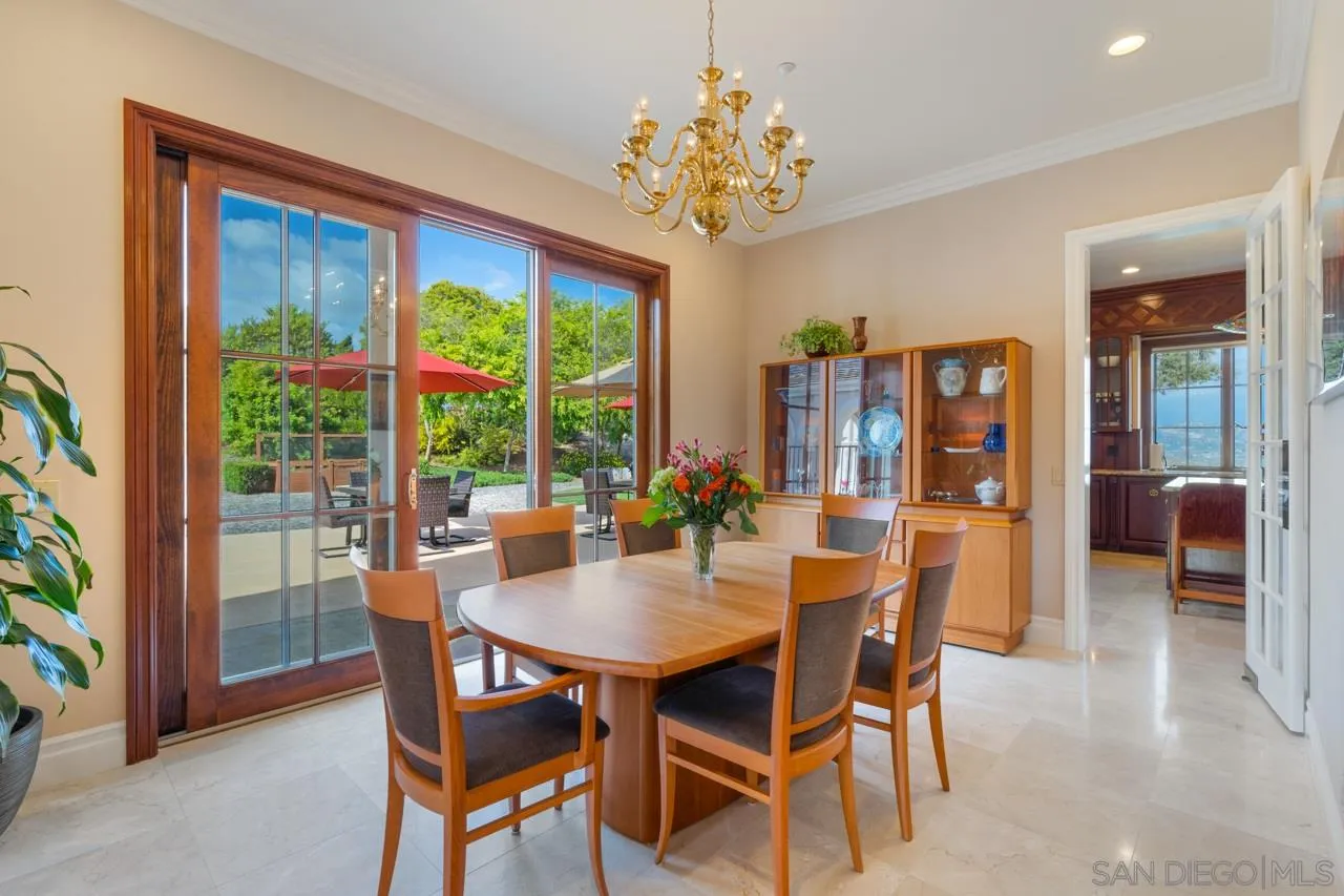 8 Rollingview Lane Fallbrook, CA 92028 - Photo 16 of 51 a dining room with furniture a chandelier and wooden floor