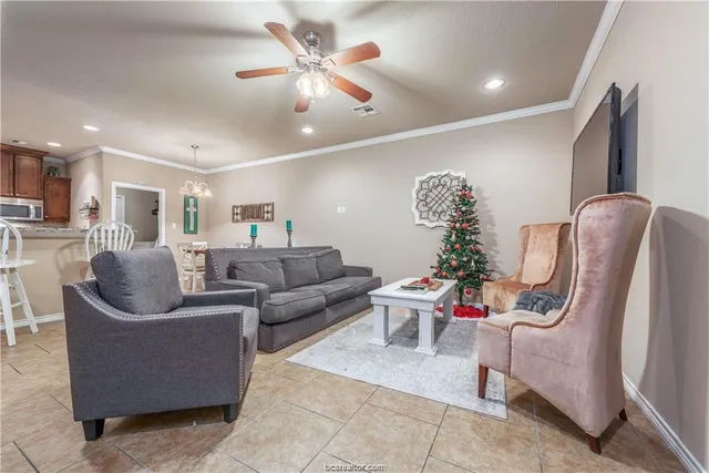 a living room with furniture and a flat screen tv