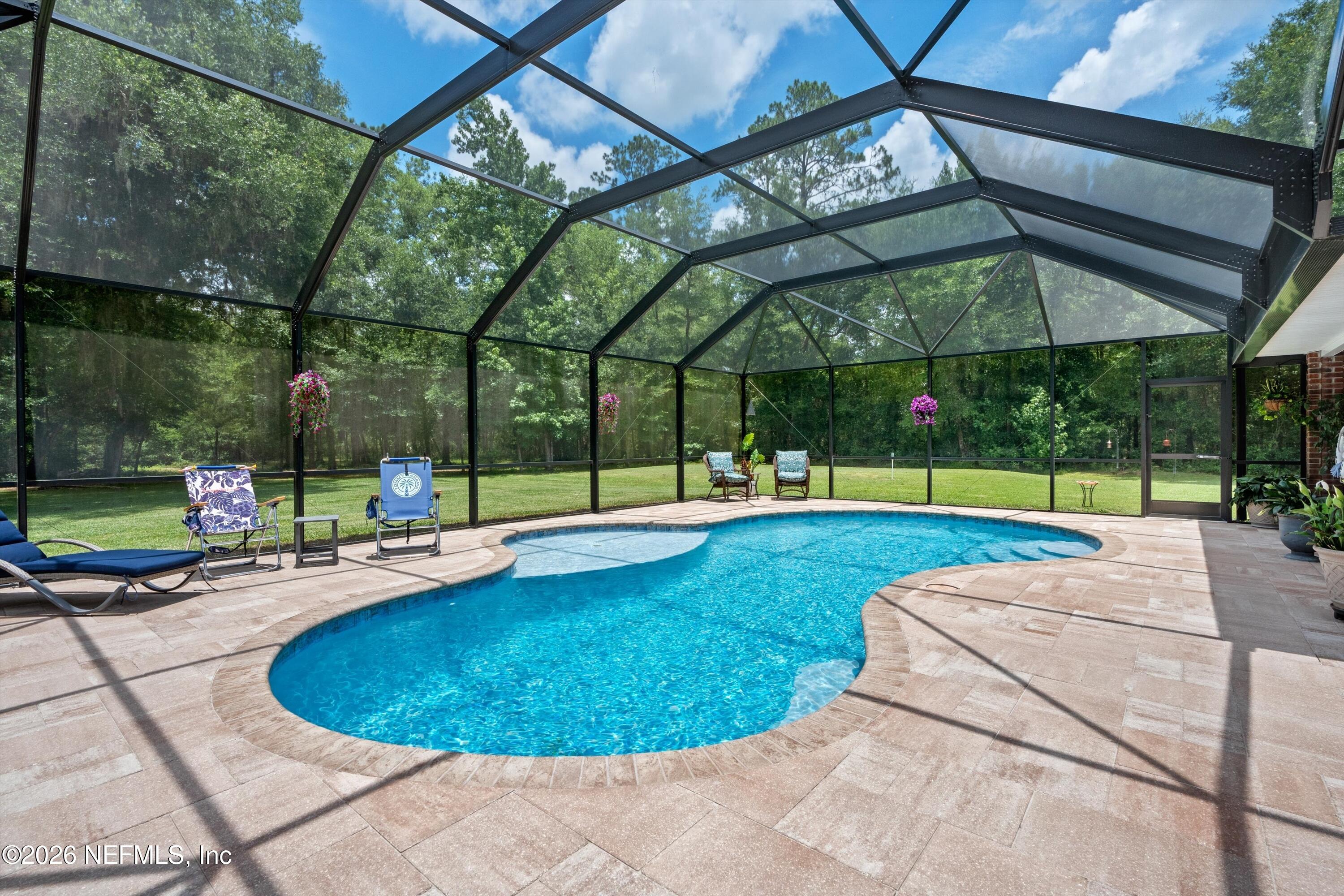 5566 Don Manuel Road Elkton, FL 32033 - Photo 36 of 47 a view of a swimming pool with a patio