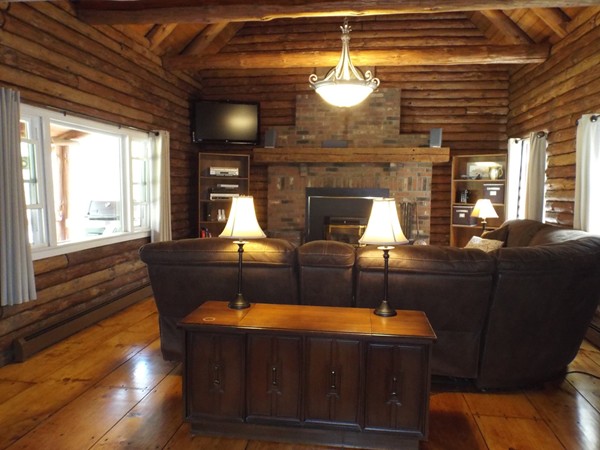 332 North Green River Road Colrain, MA 01340 - Photo 8 of 28 a living room with furniture a chandelier and a fireplace