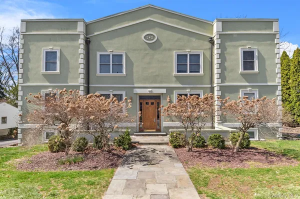 front view of a house with a yard