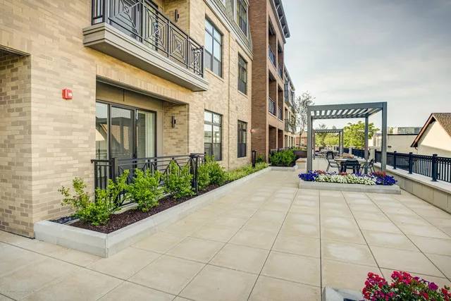 a view of a building with potted plants