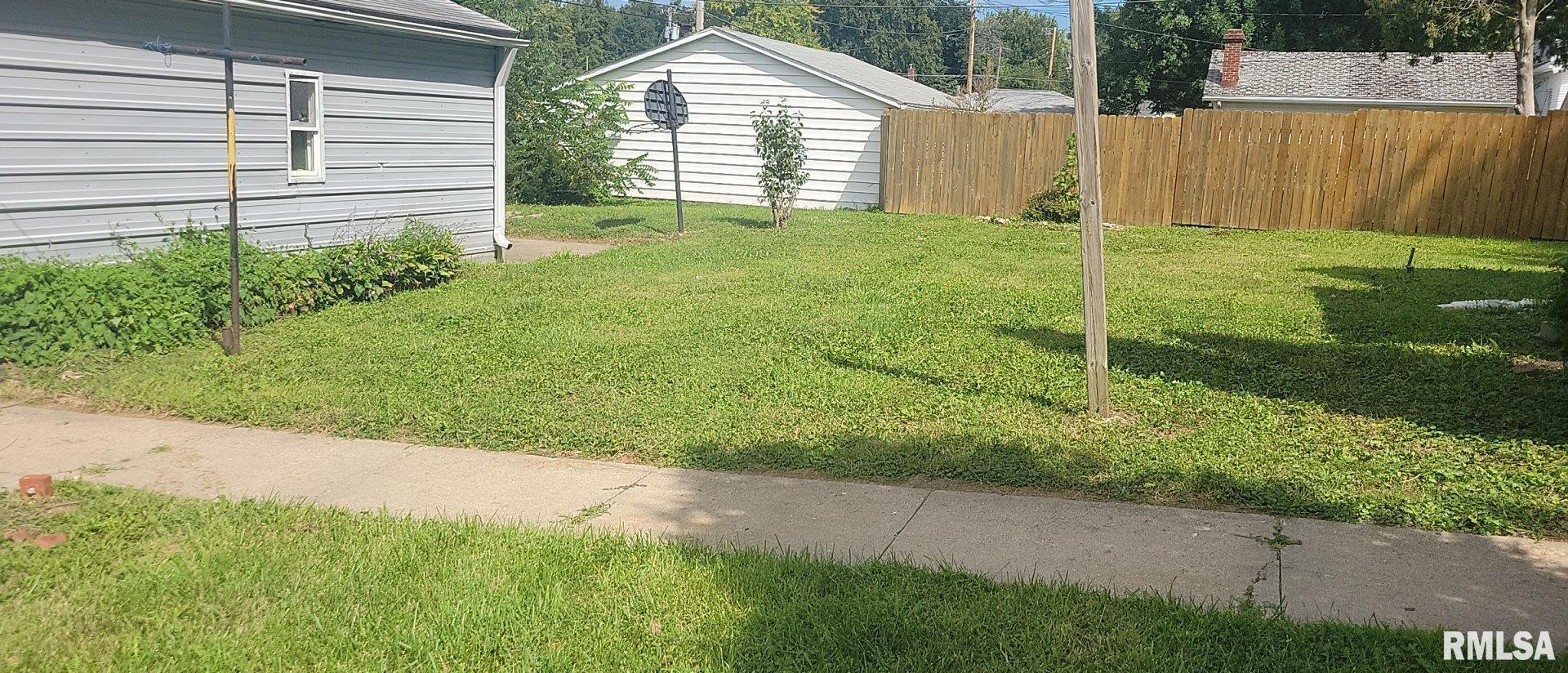 3016 Cleveland Street Clinton, IA 52732 - Photo 5 of 14 a view of backyard with green space