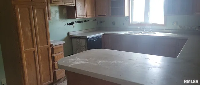 a kitchen with a sink and a microwave