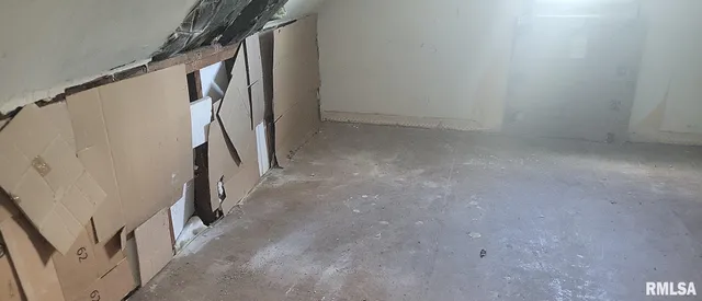 a view of staircase with wooden floor and white walls