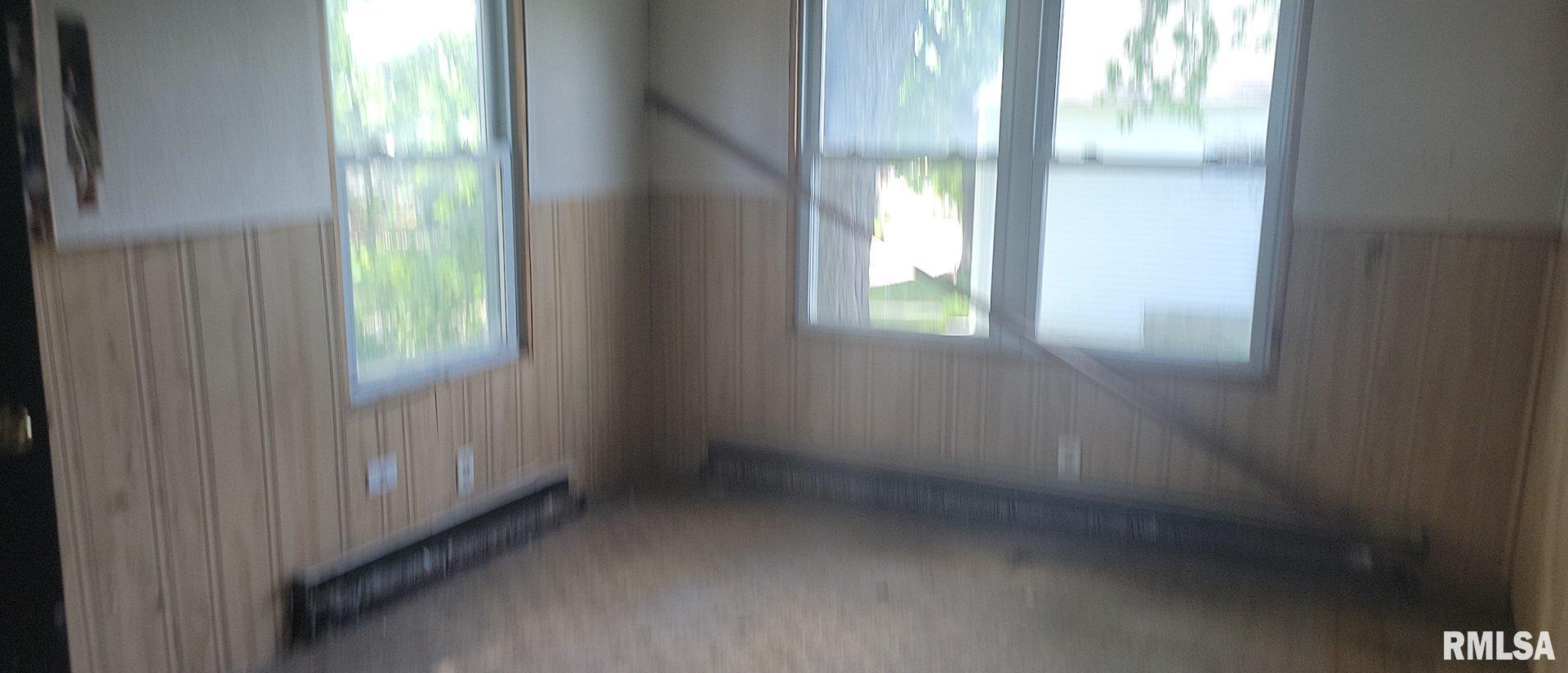 3016 Cleveland Street Clinton, IA 52732 - Photo 8 of 14 a view of an empty room with a window