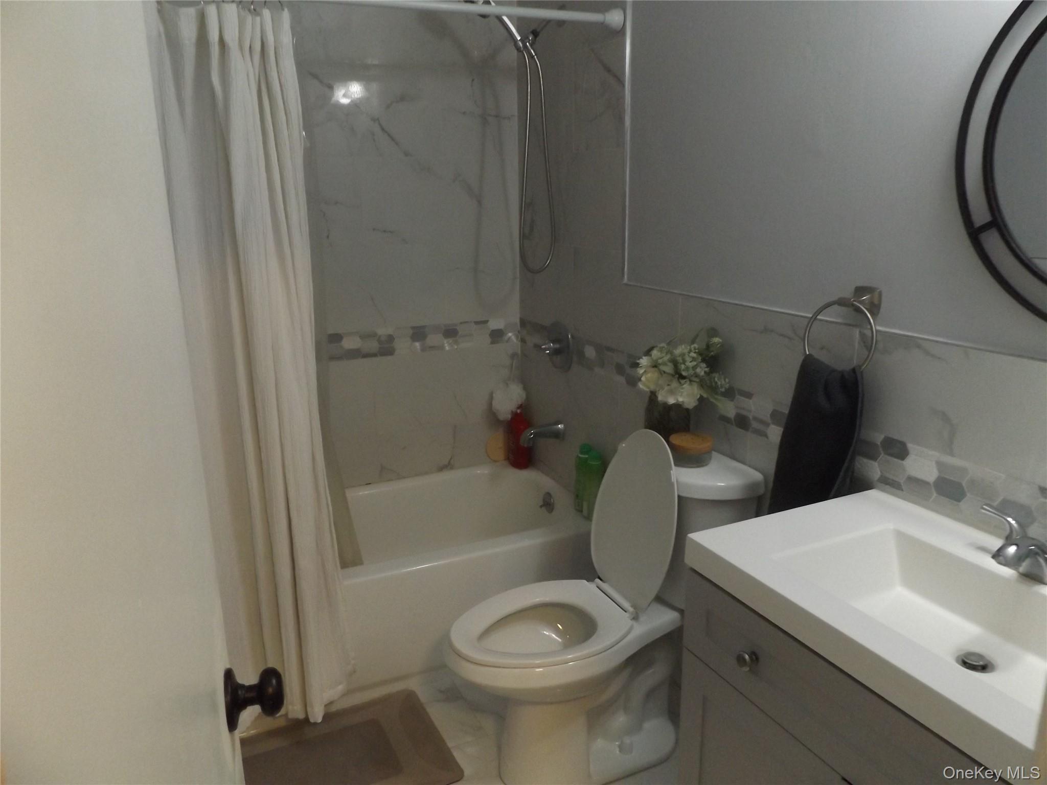 5 Millholland Drive, Unit F Fishkill, NY 12524 - Photo 10 of 13 a bathroom with a sink toilet and shower