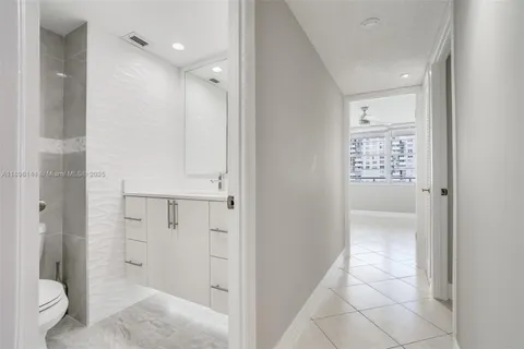 a bathroom with a shower and toilet