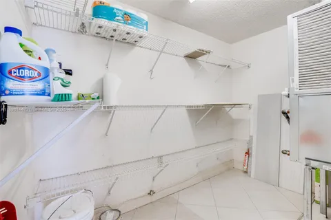 a utility room with lots of cabinet