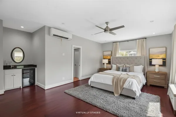 a bedroom with a bed and a table