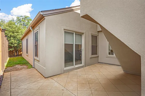 a view of backyard of house and garage