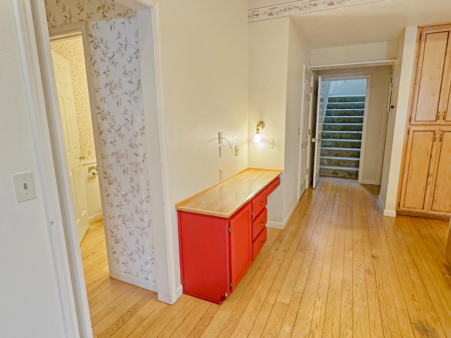 12439 Homestead Way Auburn, CA 95603 - Photo 16 of 27 a room with wooden floor and entrance