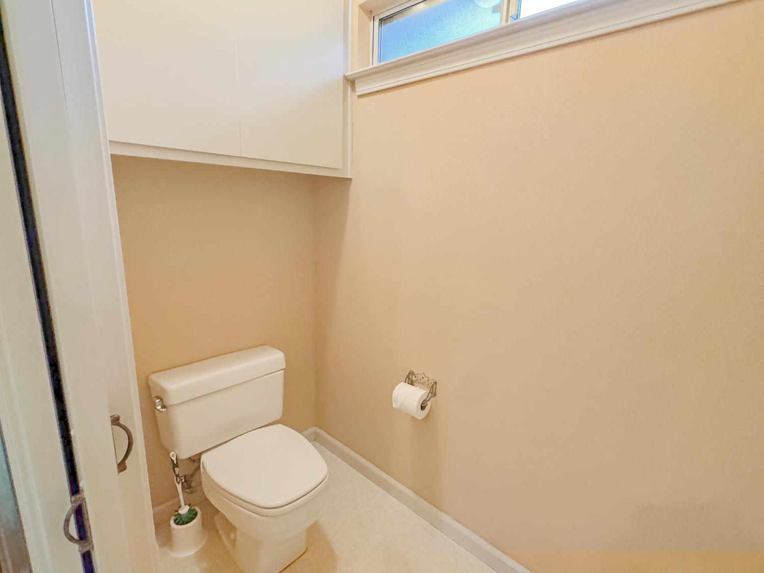 12439 Homestead Way Auburn, CA 95603 - Photo 19 of 27 a white toilet sitting next to a shower