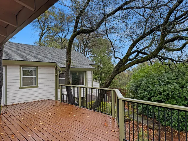 a balcony view with a backyard space