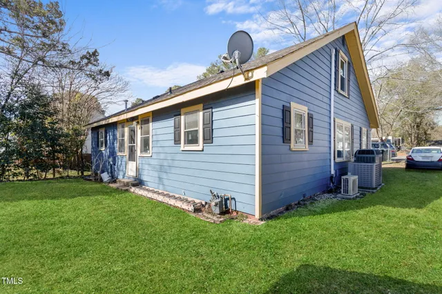 a backyard of a house with lots of green space