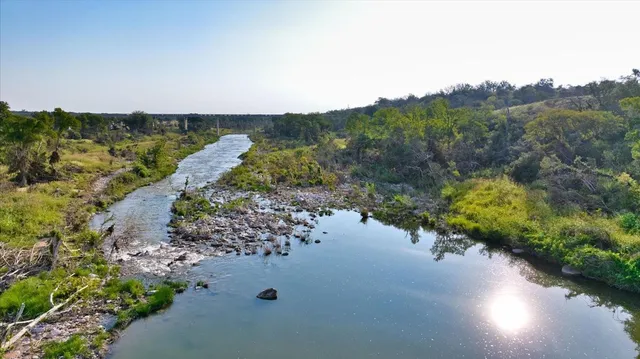 a view of a lake with mountains in the background