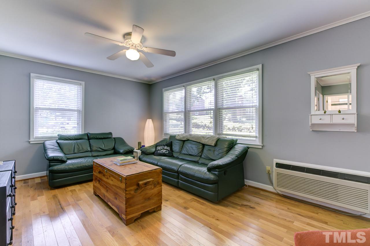821 Daniels Street, Unit B Raleigh, NC 27605 - Photo 11 of 25 a living room with furniture and a large window