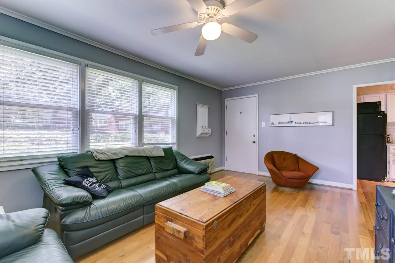 821 Daniels Street, Unit B Raleigh, NC 27605 - Photo 13 of 25 a living room with furniture and a large window